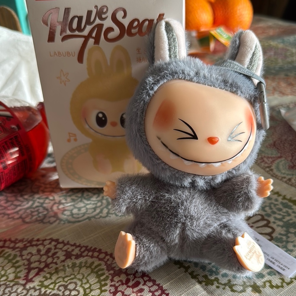 Gray Labubu popmart has QR code too the popmart website